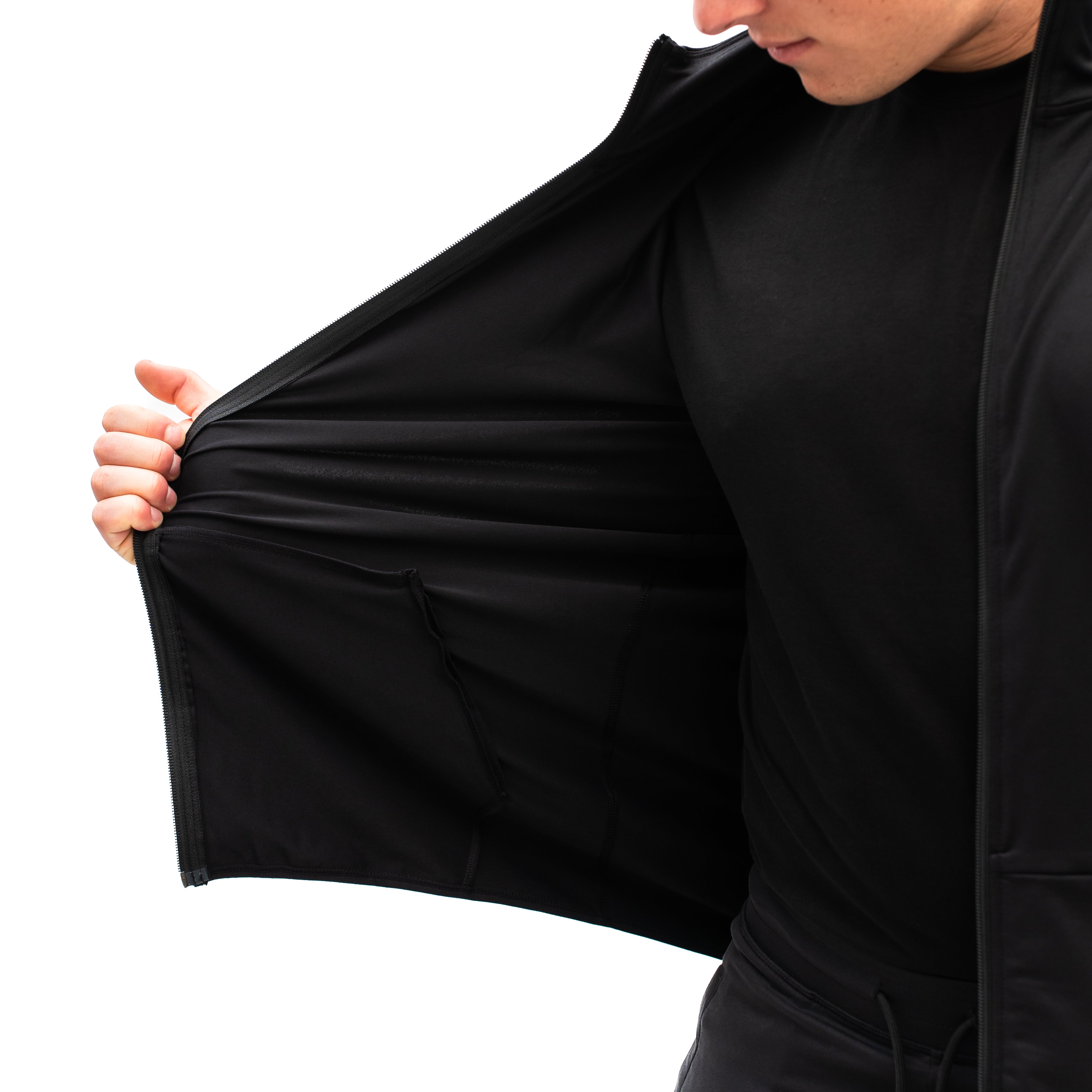 Close-up of soft, stretch knit fabric detailing on the Gold Standard Defy Jacket.