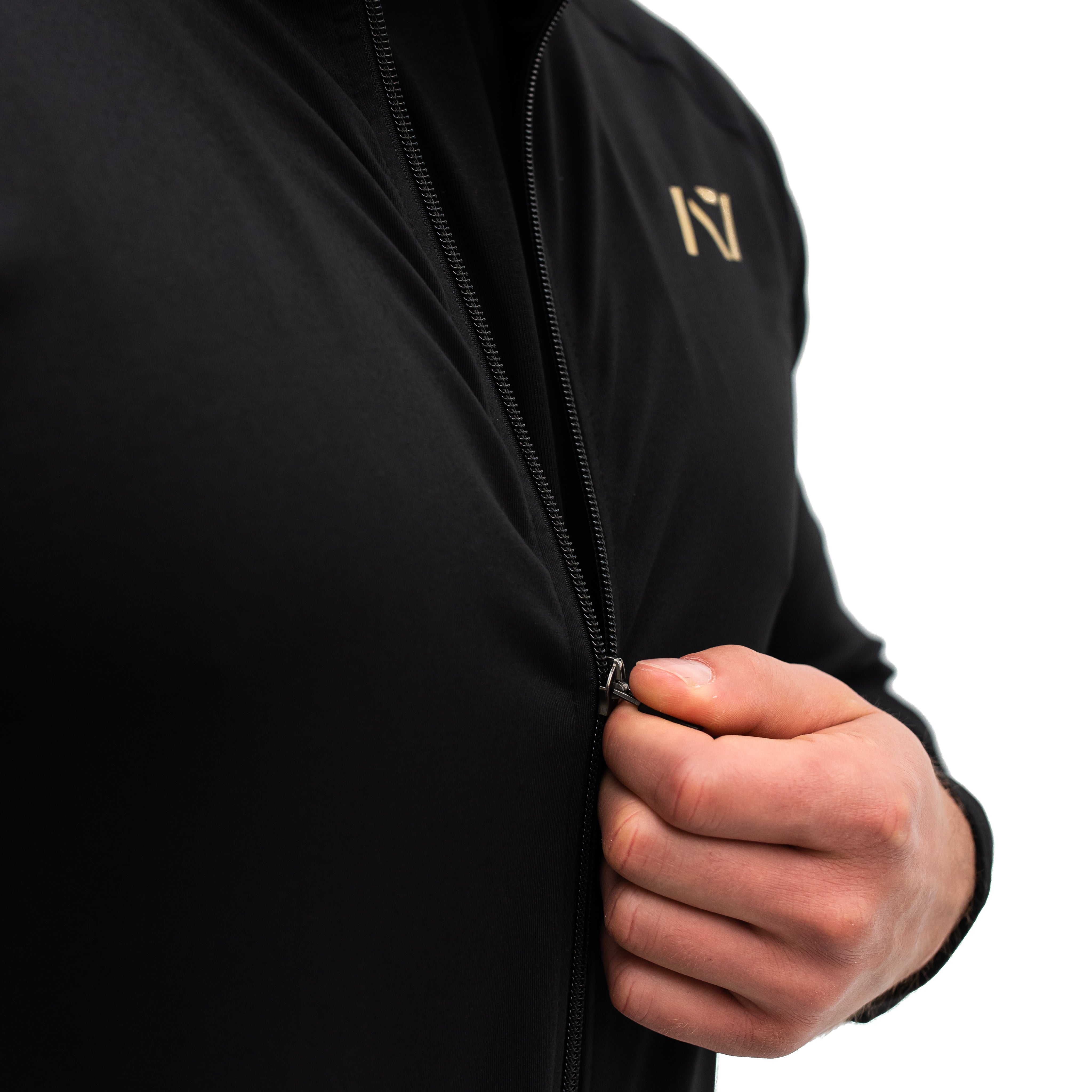 Close-up of YKK front zipper and hidden pocket zippers on the Gold Standard Defy Jacket.