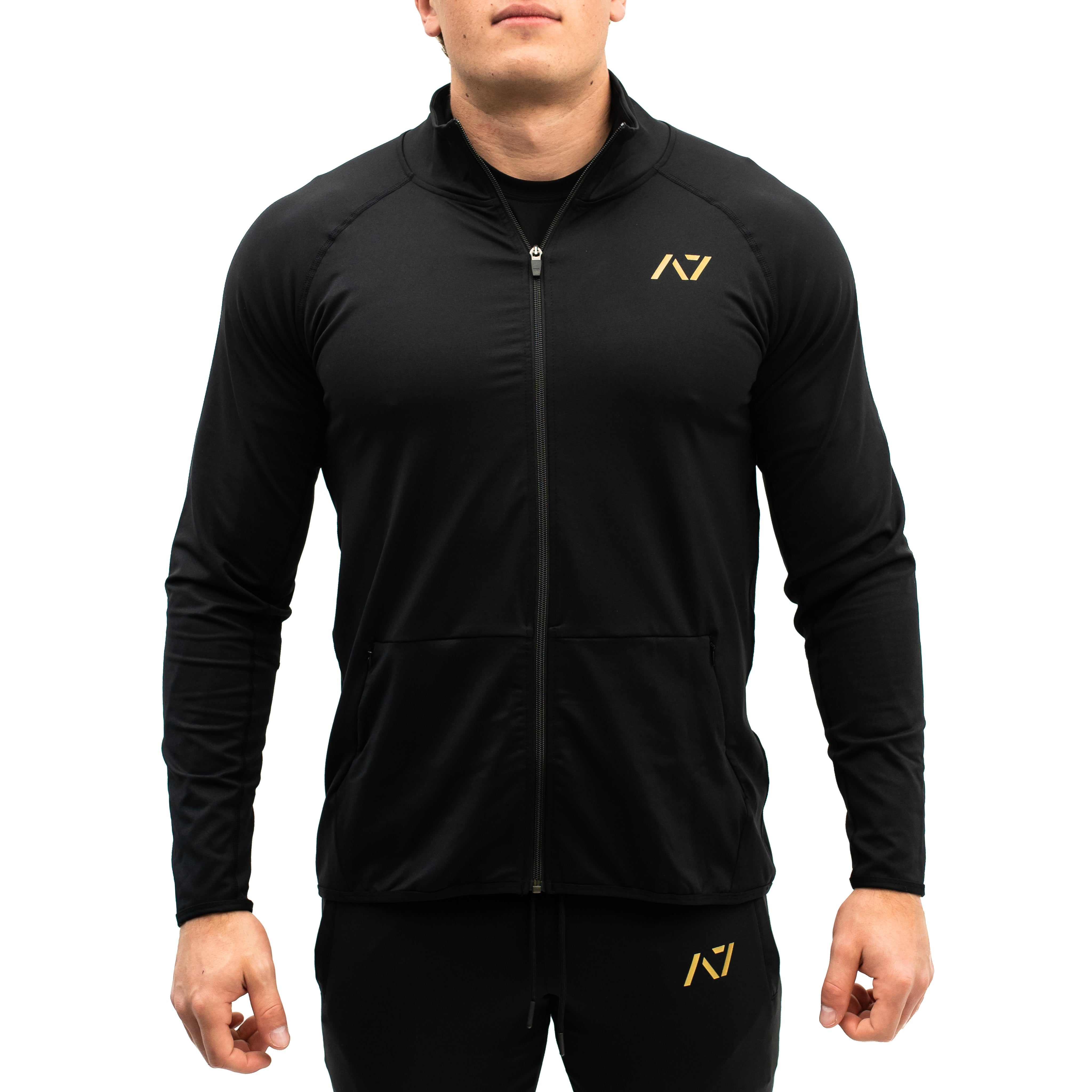 Close-up of YKK front zipper and hidden pocket zippers on the Gold Standard Defy Jacket.