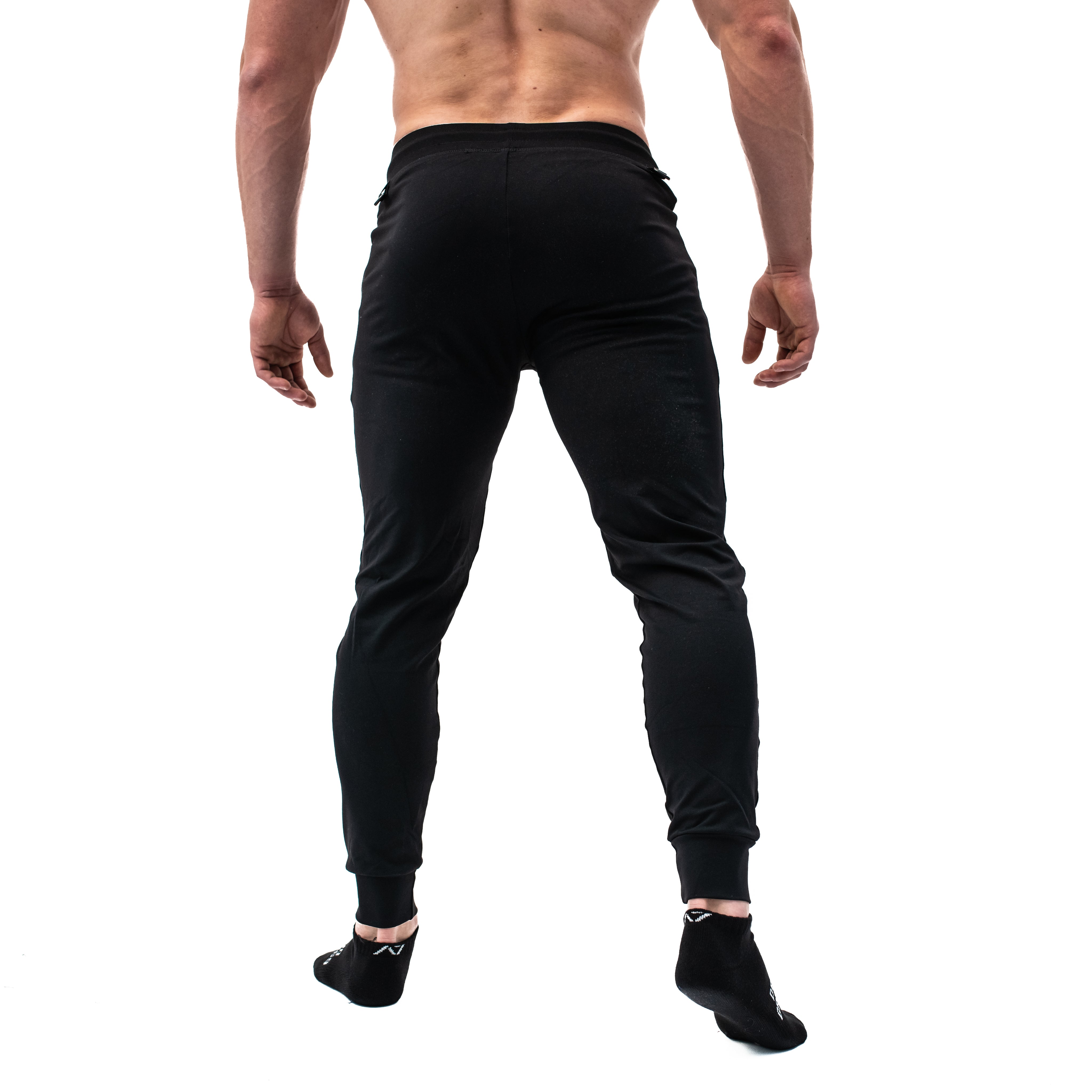 Rear view of A7 Defy Joggers – Black, displaying clean back without pockets and athletic silhouette.