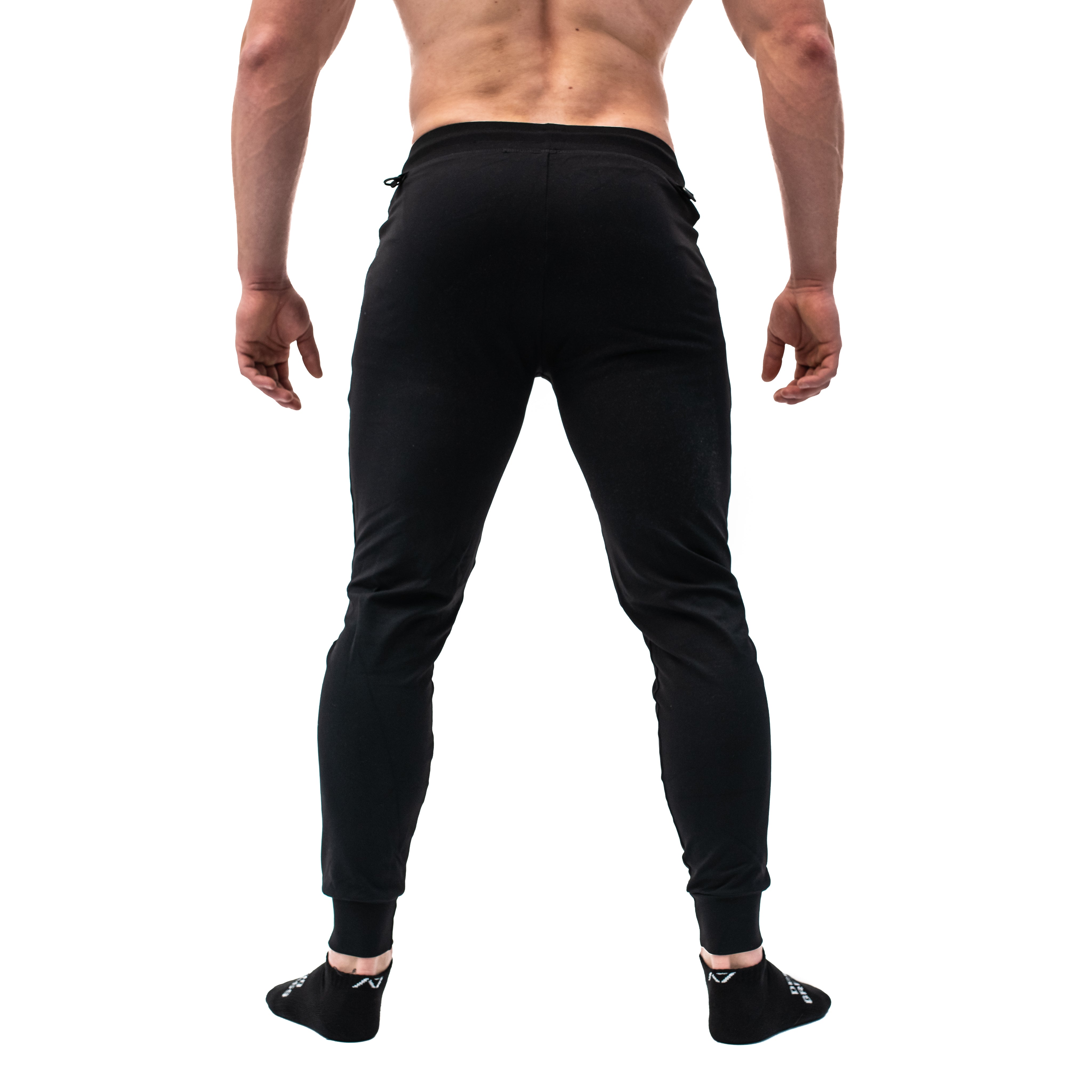 Rear view of A7 Defy Joggers – Black, displaying clean back without pockets and athletic silhouette.