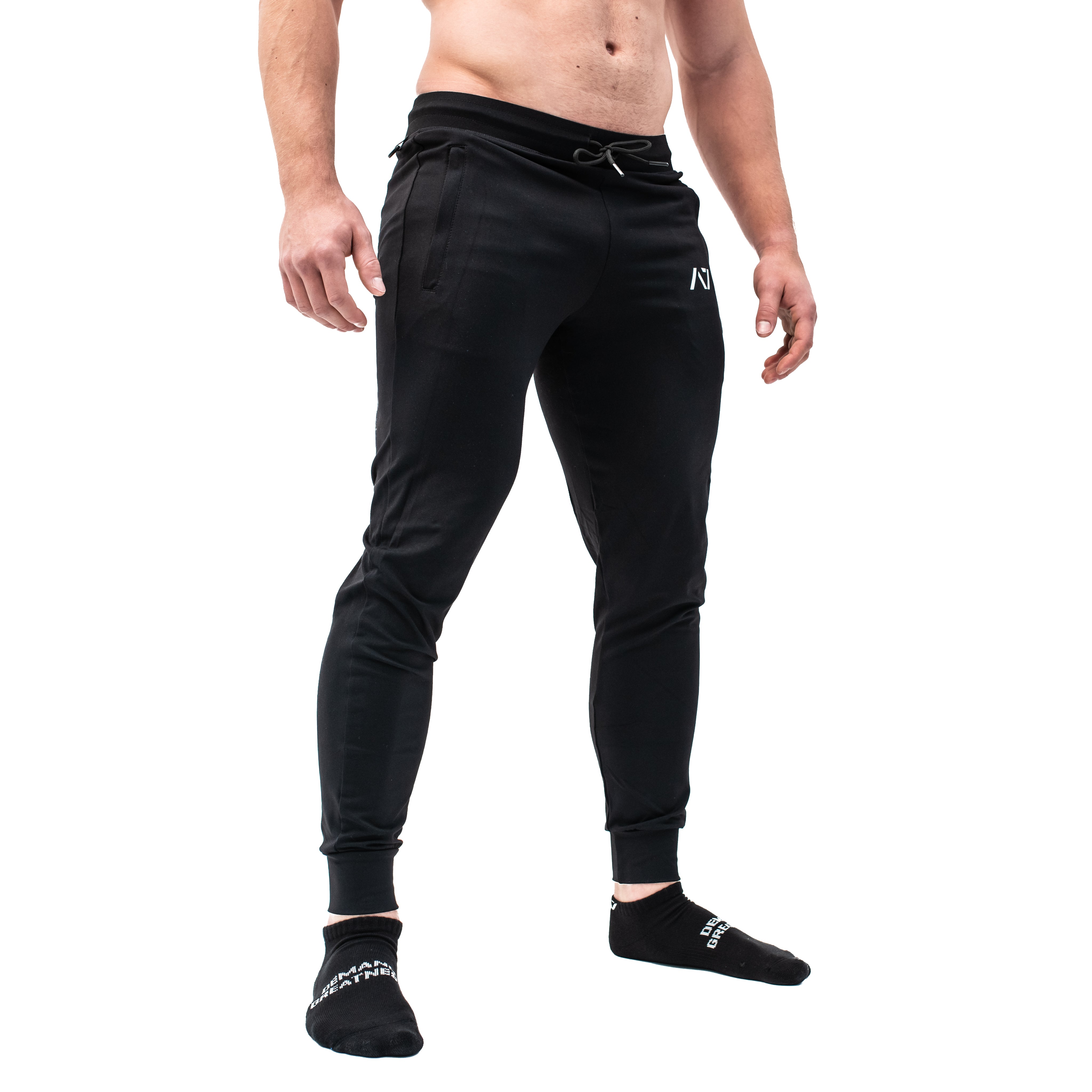 Side profile of A7 Defy Joggers – Black showing elastic cuff, key clip, and stretch fit.