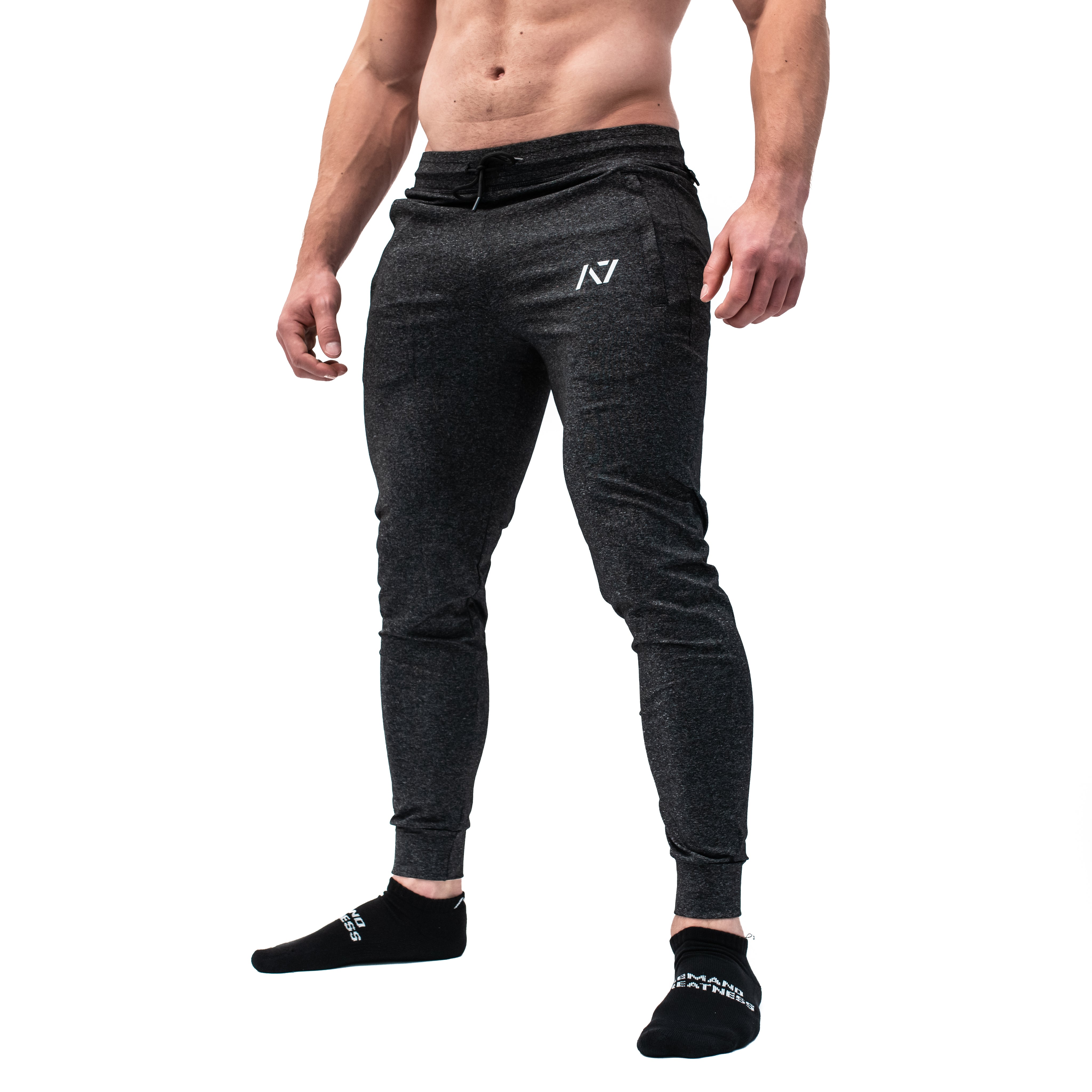 Side profile of A7 Defy Joggers – Charcoal showing elastic cuff and integrated key clip for fixture.