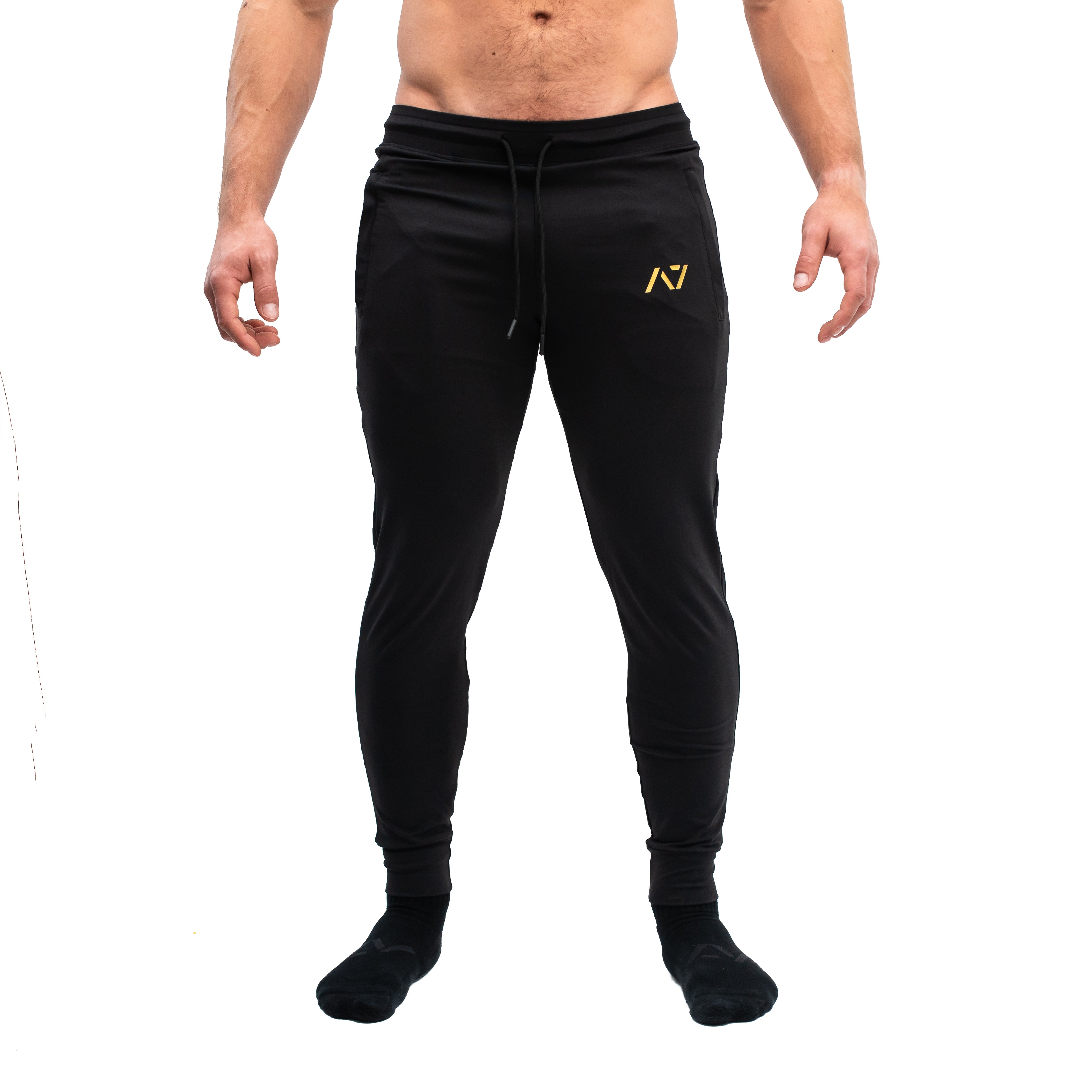 Front view of Gold Standard Defy Joggers with mid-rise waist, tapered leg, and zippered front pocket.