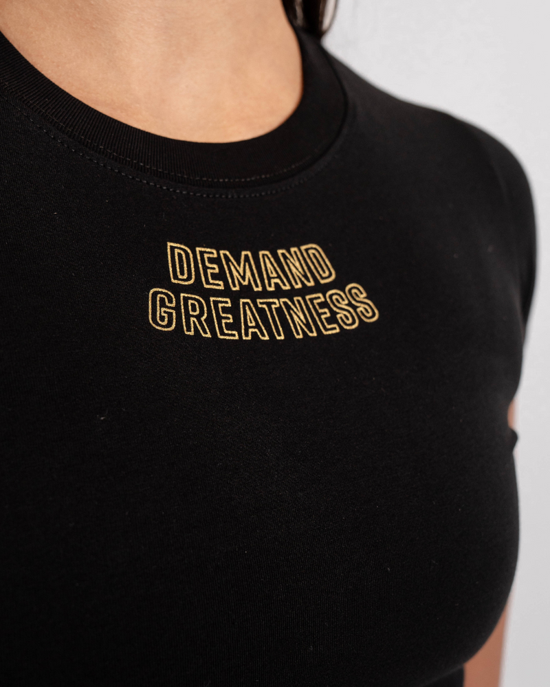 
                  
                    Demand Greatness True-Fit Women's Meet Shirt - Gold Standard
                  
                