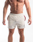 A pair of white 360Go 1Z KWD shorts with red accents, featuring a drawstring waist and side pockets.