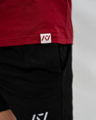 Red Bar Grip Shirt with a logo on a plain background