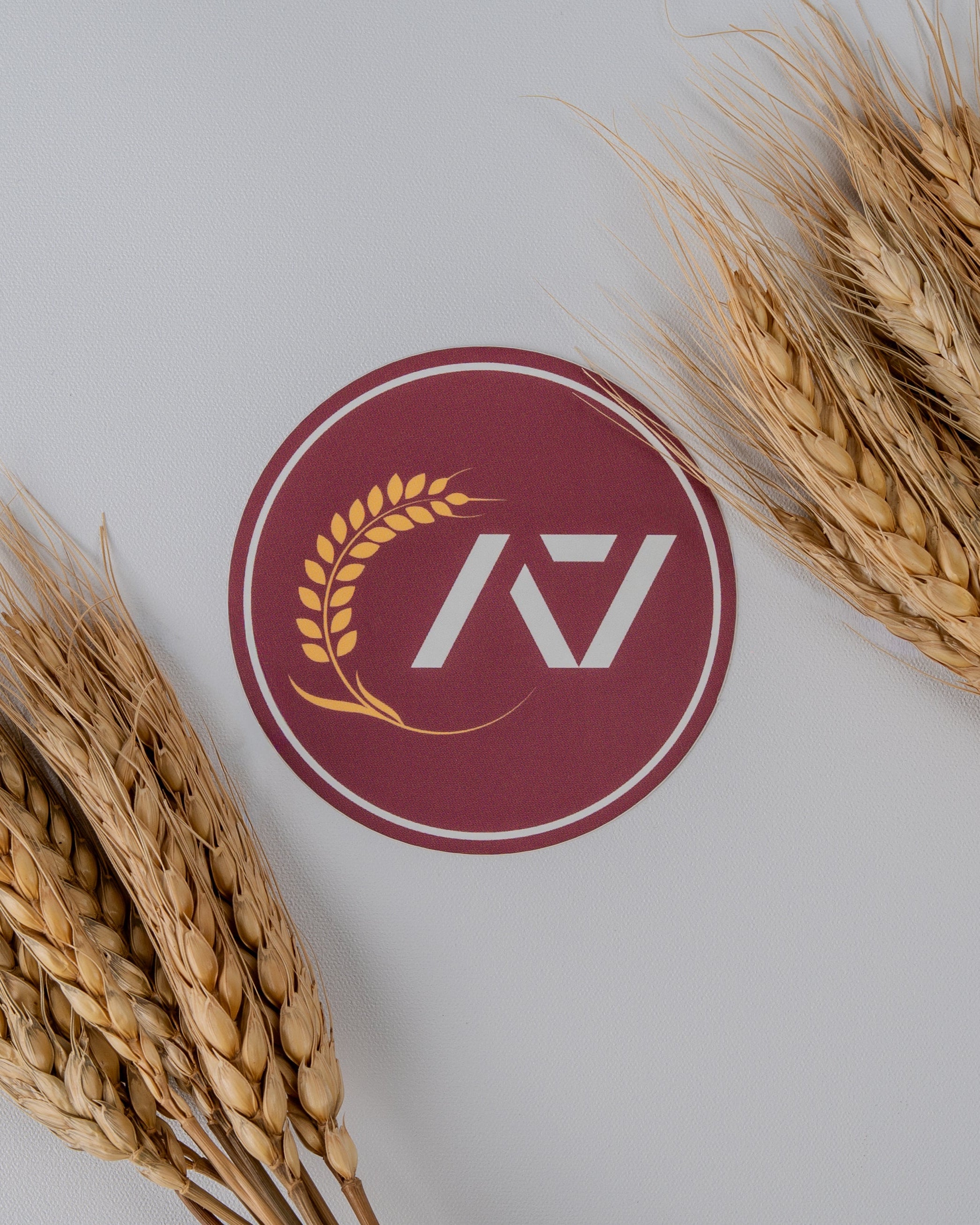 A7 logo sticker with wheat on a light gray background