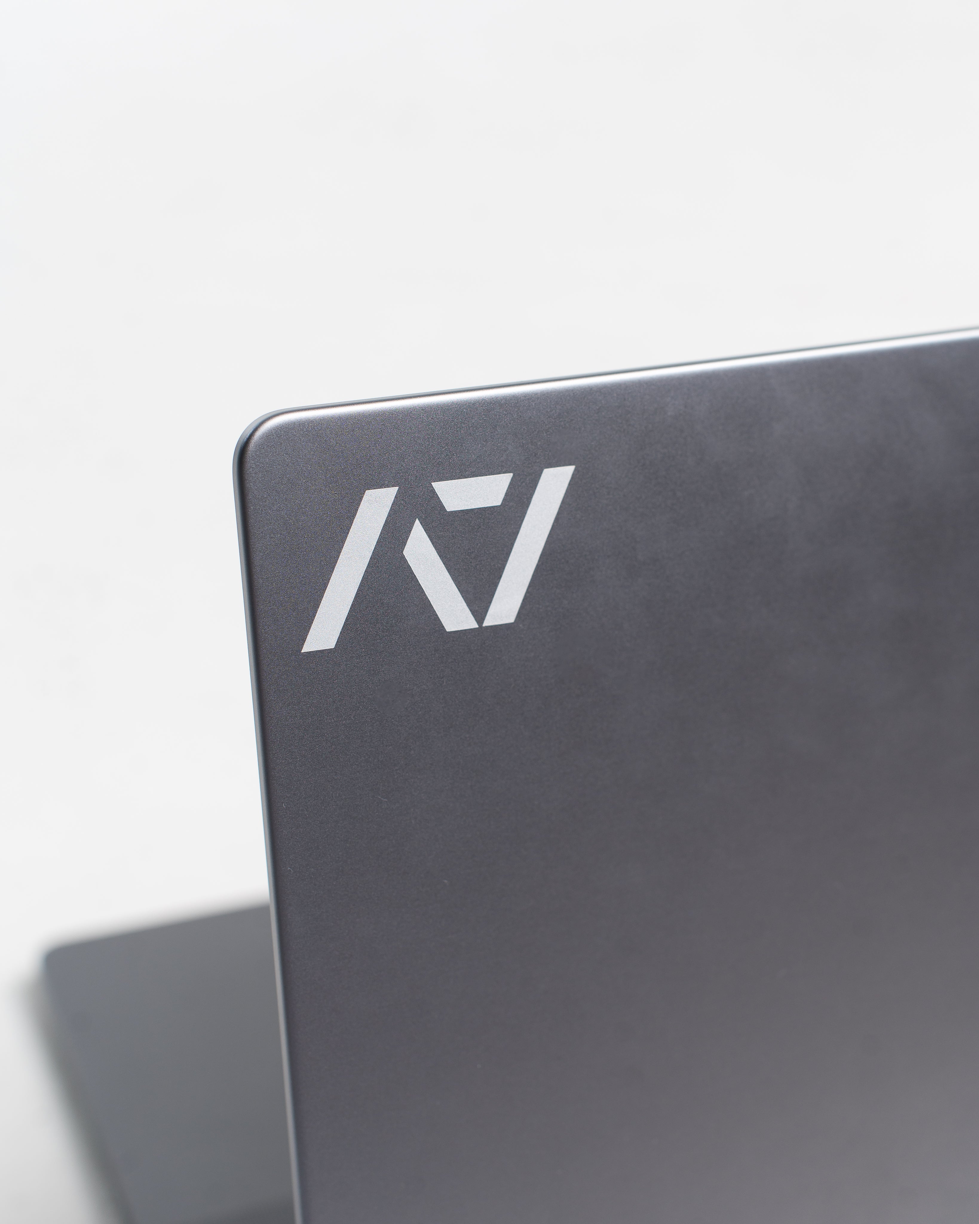A7 White Decal applied to a dark laptop surface, showcasing bold contrast and clean application.