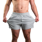 Close-up of 360-degree stretch fabric on Light Gray 360Go KWD Shorts for freedom of movement during training.