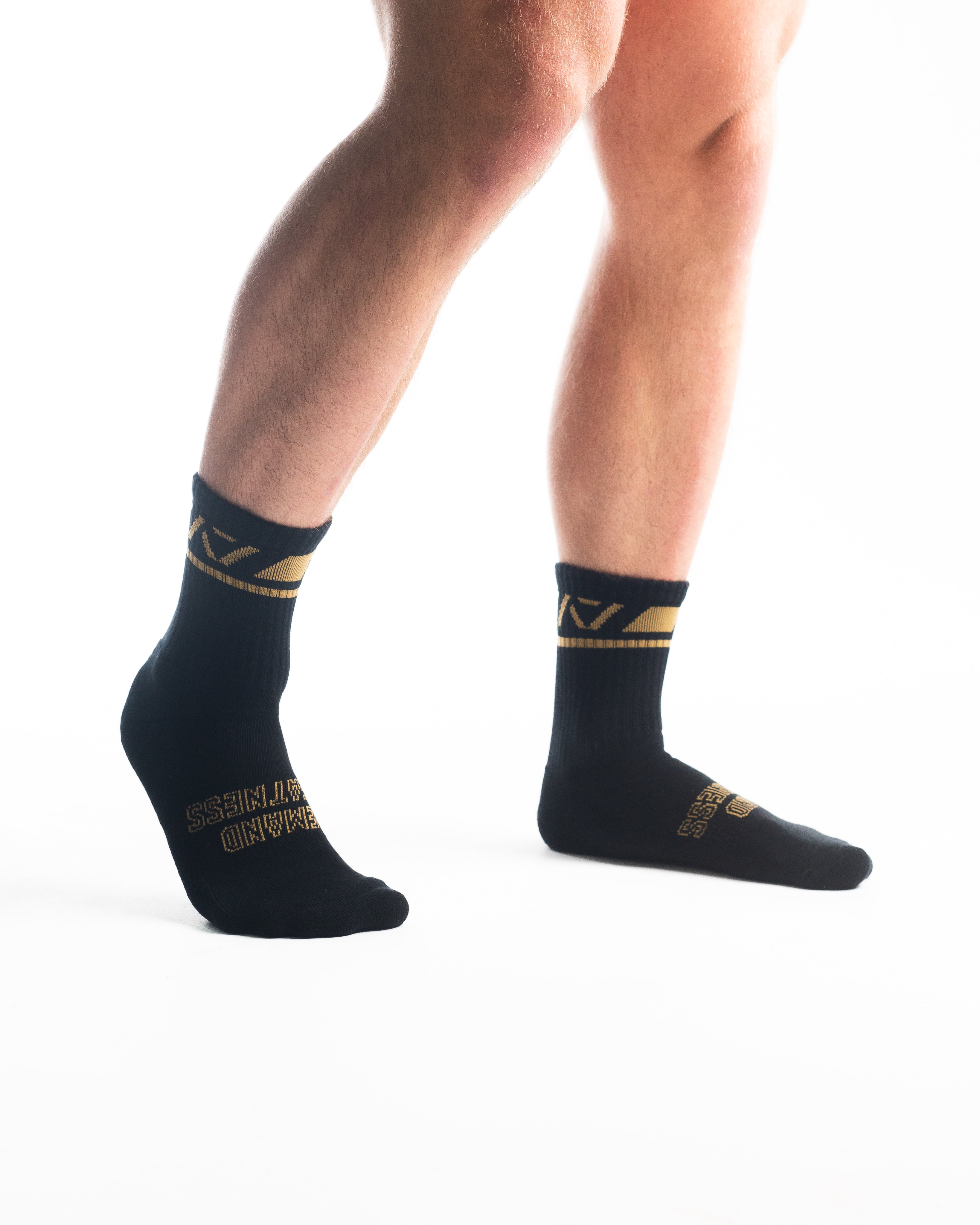 Front view of A7 Crew Socks in Gold Standard, showcasing mid-shin length and ribbed cuff design.