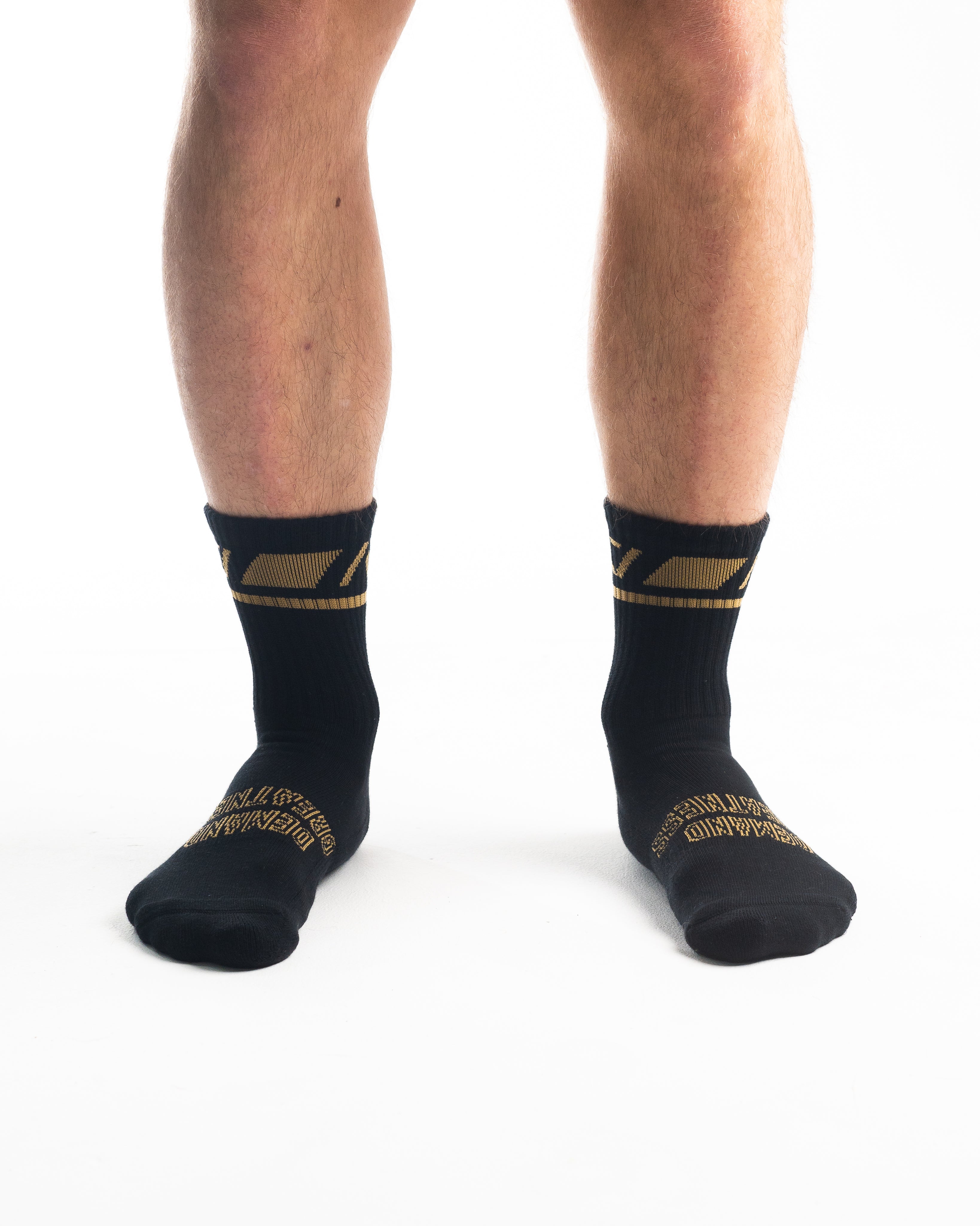 Front view of A7 Crew Socks in Gold Standard, showcasing mid-shin length and ribbed cuff design.